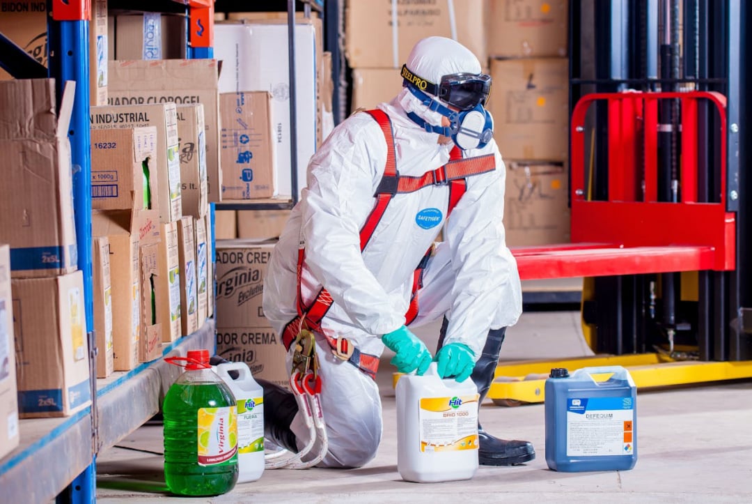 Photo by Pixabay: https://www.pexels.com/photo/person-wearing-white-suit-holding-white-container-209230/